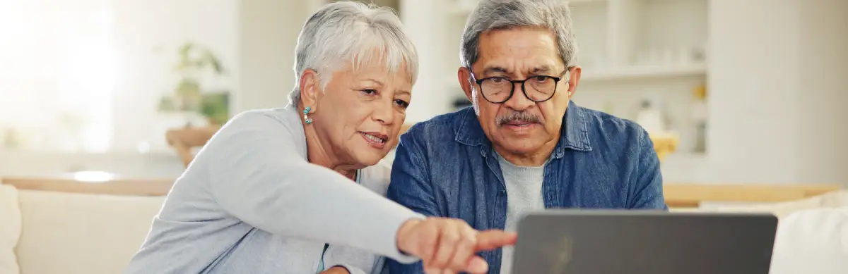 image of a couple using a laptop