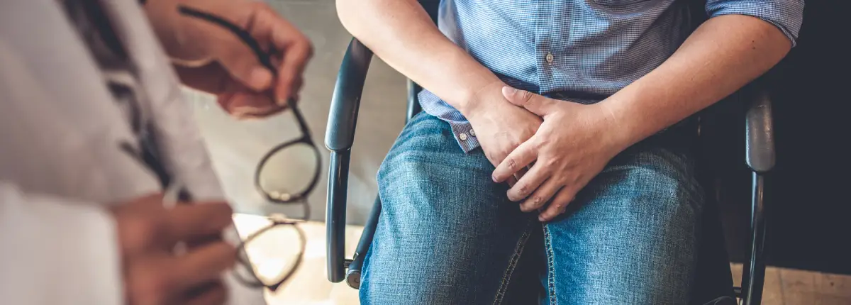 image of a man holding his groin